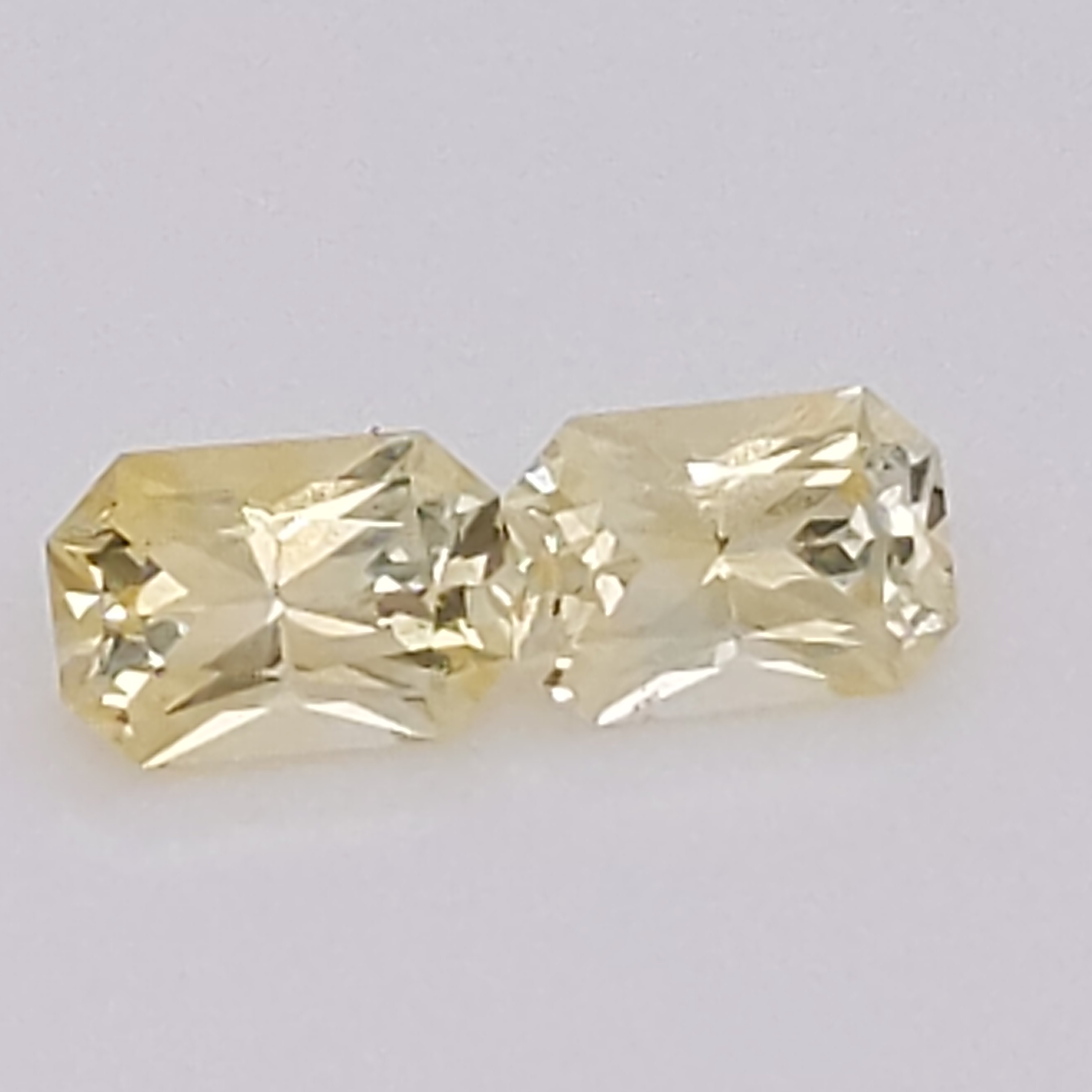 Ceylon emerald cut yellow sapphire pair